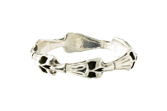 Close-up of sterling silver skull stack ring showing cheekbone detail and skull structure, shot at a three quarter angle